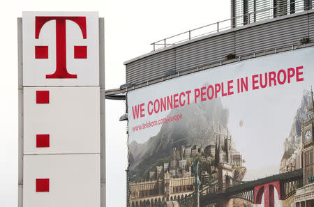 FILE PHOTO: The logo of German telecommunications giant Deutsche Telekom AG is seen at the company's headquarters in Bonn February 25, 2016. REUTERS/Wolfgang Rattay/File Photo