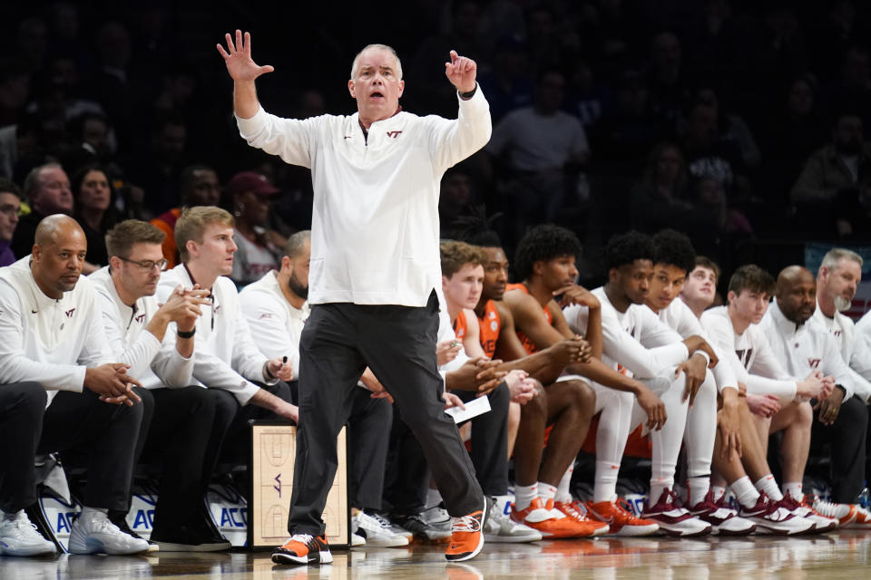 FILE - Virginia Tech coach Mike Young stands near the bench during the first half of an NCAA college basketball game against North Carolina during semifinals of the Atlantic Coast Conference men's tournament March 11, 2022, in New York. The Hokies are coming off their first ACC tournament championship but were picked to finish just seventh in the league this season despite having a large part of their nucleus, led by do-everything graduate student Justyn Mutts and senior 3-point specialist Hunter Cattoor, back for coach Young. (AP Photo/John Minchillo, File)