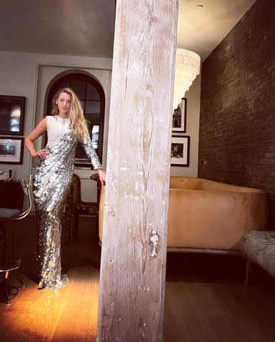 <p>Blake Lively/Instagram</p> Lively poses in a sparkly silver outfit.