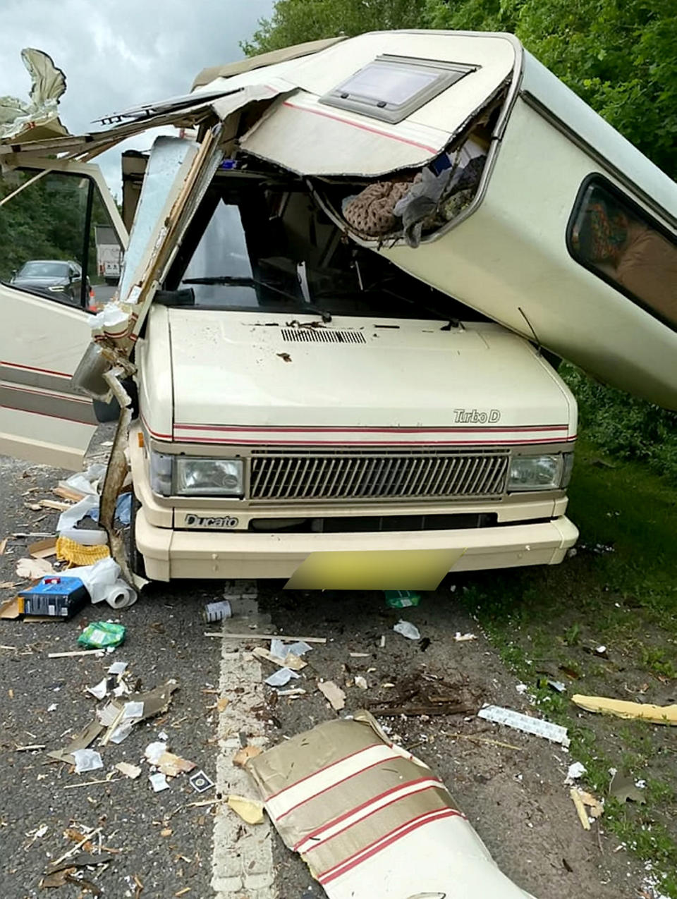 Dramatic crash scene involving a camper van and a 4x4 on the A46 at Bishopton, Stratford-upon-Avon, Warwickshire, on thurdsay afternoon, June 10, 2021.  See SWNS story SWMDcrash.  The camper van had stopped on the side of the road after a tyre had blown out, when the other vehicle came into contact with it. Thankfully no people were in the camper at the time of the collision and no other people were trapped. 