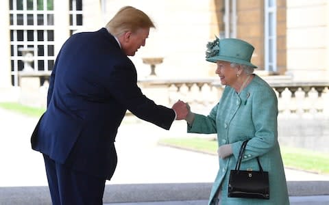 The Queen greets Donald Trump with what looks like a fist-bump at first glance - Credit: PA/Victoria Jones