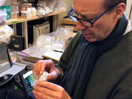 FILE PHOTO: Professor Alexander Van Geen, Research Professor of Geochemistry at Columbia University, tests lead samples from Fort Benning, Georgia at the Lamont-Doherty Earth Observatory in Palisades, New York, U.S. March 29, 2018. REUTERS/Mike Wood/File Photo