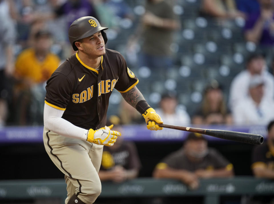 San Diego Padres' Manny Machado flies out against Colorado Rockies starting pitcher Austin Gomber in the fourth inning of a baseball game Monday, June 14, 2021, in Denver. (AP Photo/David Zalubowski)