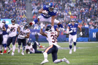 <p>Saquon Barkley #26 of the New York Giants leaps over Adrian Amos #38 of the Chicago Bears for extra yardage during the third quarter at MetLife Stadium on December 02, 2018 in East Rutherford, New Jersey. (Photo by Al Bello/Getty Images) </p>