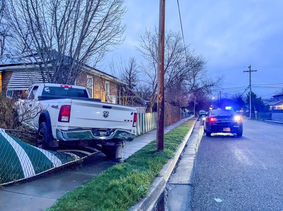 A white truck crashed into the yard of a home in the Glendale neighborhood (SLCPD photo, March 31, 2024)
