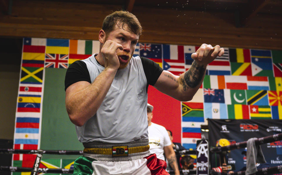 SAN DIEGO, CA - OCTOBER 20:  (EDITOR'S NOTE: Alternate crop) WBA, WBO, WBC and The Ring super middleweight title holder Canelo Alvarez boxes during his media workout at Canelo's Gym on October 20, 2021 in San Diego, California. (Photo by Matt Thomas/Getty Images)