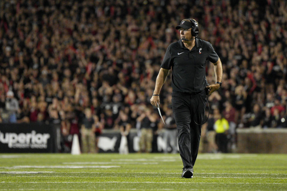 Cincinnati head coach Scott Satterfield walks on the field during a stoppage in play in the second half of an NCAA college football game against Miami (Ohio), Saturday, Sept. 16, 2023, in Cincinnati. (AP Photo/Jeff Dean)