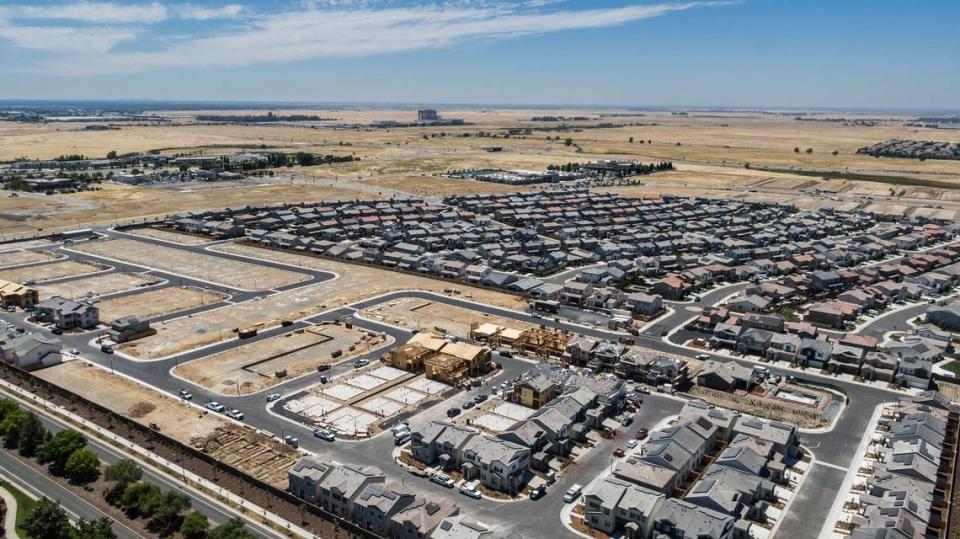 A housing development in Lincoln on Monday, July 24, 2023, reaches Highway 65. Over the past three years, the city’s growth rate was the fifth highest among cities in California with at least 40,000 residents, according to The Bee’s analysis