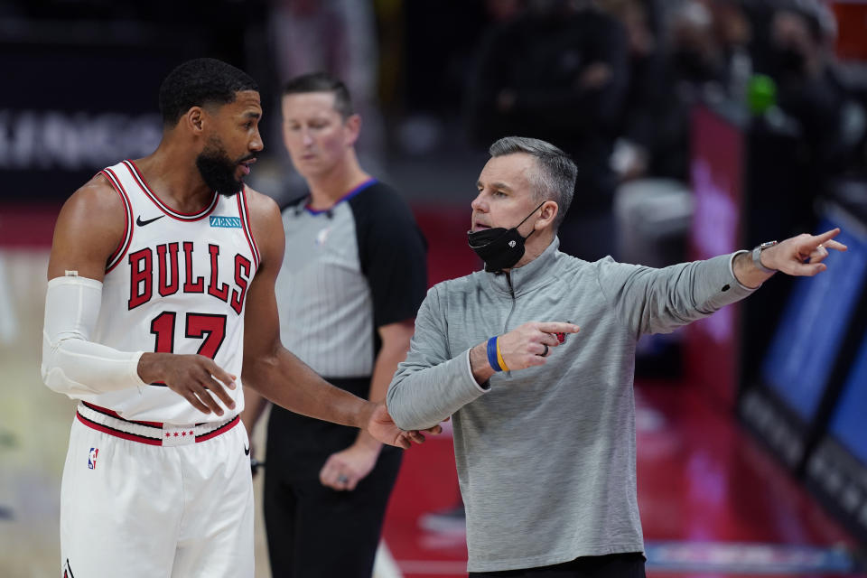 Chicago Bulls head coach Billy Donovan talks to forward Garrett Temple during the second half of an NBA basketball game against the Detroit Pistons, Sunday, May 9, 2021, in Detroit. (AP Photo/Carlos Osorio)