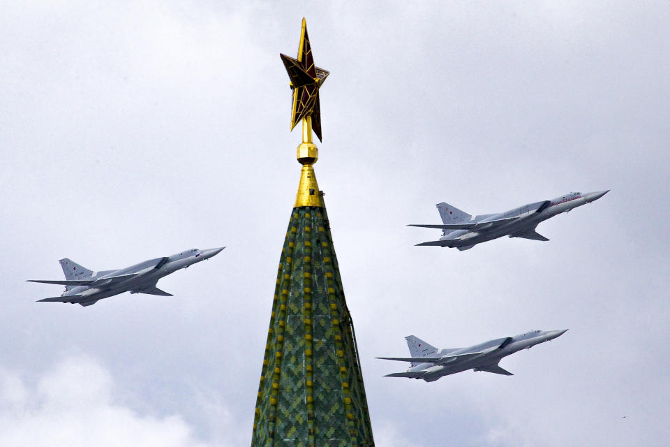 FILE - In this Thursday, May 5, 2016 file photo, Russian Tu-22M3 bombers fly over the Kremlin's Tower with a Red Star on the top during a general rehearsal for the Victory Day military parade which will take place at Moscow's Red Square on May 9 to celebrate 71 years after the victory in WWII in Moscow, Russia. The Russian military said Tuesday May 25, 2021, it has deployed three nuclear-capable long-range Tu-22M3 bombers to its base in Syria, a move that would strengthen Moscow's military foothold in the Mediterranean. (AP Photo/Ivan Sekretarev, File)