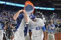 Jul 21, 2018; Kansas City, MO, USA; Kansas City Royals relief pitcher Brian Flynn (33) (left) and relief pitcher Wily Peralta (43) are doused by catcher Salvador Perez (13) (not pictured) after the win over the Minnesota Twins at Kauffman Stadium. The Royals won 4-2. Mandatory Credit: Denny Medley-USA TODAY Sports