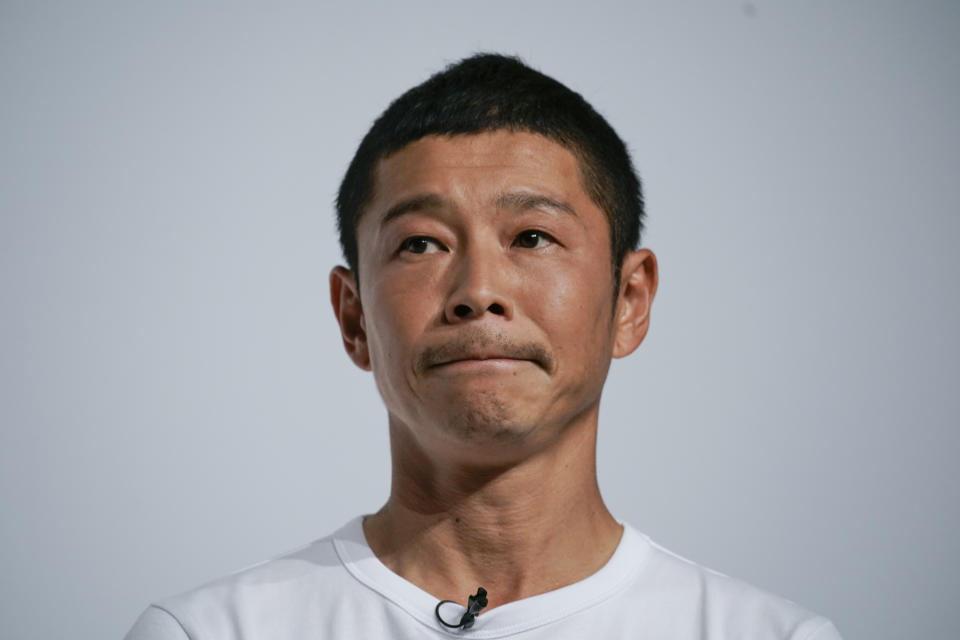 Zozo founder Yusaku Maezawa attends a news conference Thursday, Sept. 12, 2019, in Tokyo. Yahoo Japan Corp. said Thursday, Sept. 12, 2019 it will put up a tender offer, estimated at 400 billion yen ($3.7 billion), for Zozo Inc., a Japanese online retailer started by a celebrity tycoon. (AP Photo/Jae C. Hong)