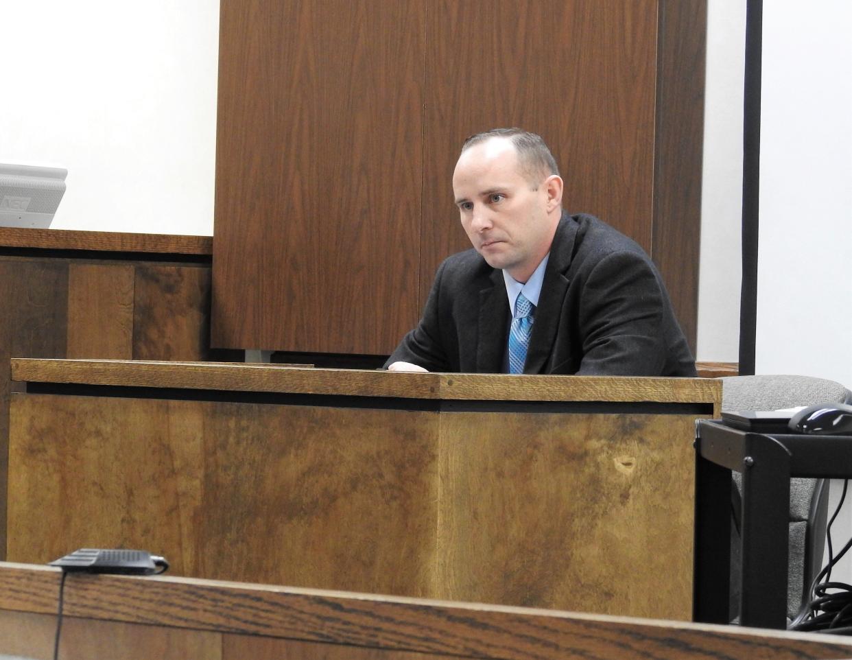 Craig Bordenkircher on the stand during his bench trial relating to a dilapidated structure on his property, namely a garage with an alleged bad roof.