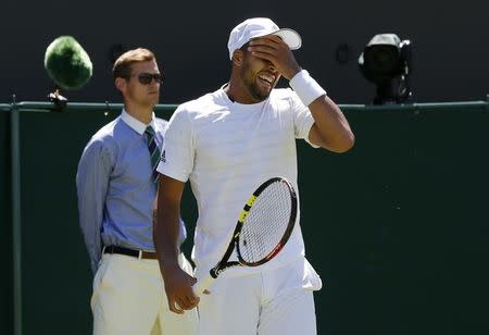 Jo-Wilfried Tsonga of France reacts during his match against Gilles Muller of Luxembourg at the Wimbledon Tennis Championships in London, June 30, 2015. REUTERS/Suzanne Plunkett