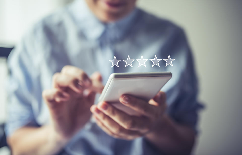 Woman using here phone to send emails and the review the schedule for the day