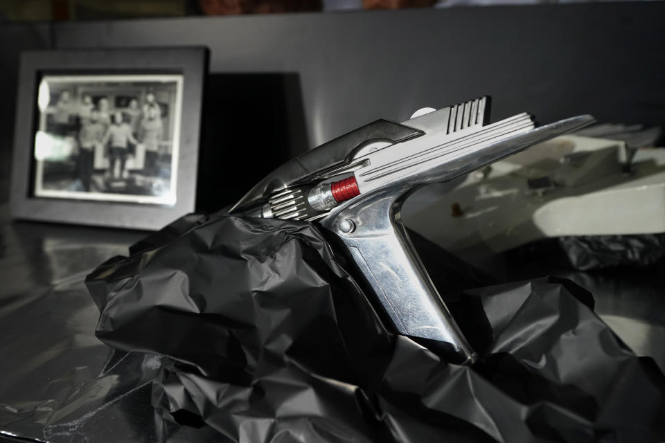 A prop called the Phaser Pistol, that was used in the 1960's televsion series Star Trek, sits on display at Heritage Auctions, Thursday, Aug. 30, 2023, in Irving, Texas. While Greg Jein's work over nearly half a century making miniature models in Hollywood included such iconic creations as the alien mothership in "Close Encounters of the Third Kind," he was also a lifelong collector of costumes, props, scripts, artwork and photographs from the shows he loved, including countless rare items from the "Star Trek" and "Star Wars" franchises. Thousands of those items, including those Jein collected and those he created, will be offered up by Heritage Auctions next month in Dallas. (AP Photo/Tony Gutierrez)