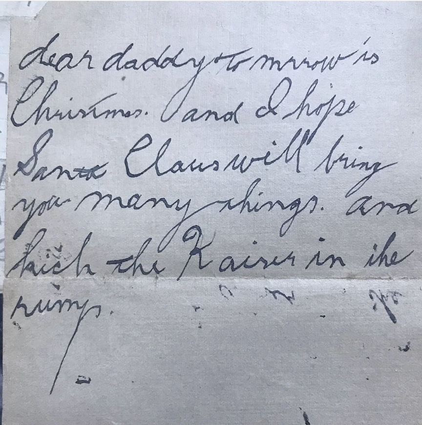 A handwritten letter reads: "Dear Daddy, tomorrow is Christmas. And I hope Santa Claus will bring you many things. And kick the Kaiser in the rump."