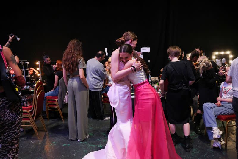 Dresses based on drawings of a victim of Serbia's school shooting are presented during a Fashion Week in Belgrade