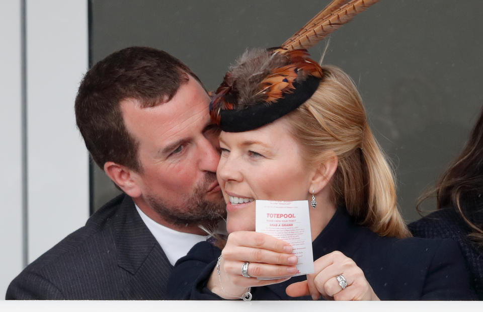 Peter Phillips kisses wife Autumn Phillips as they attend day 4 'Gold Cup Day' of the Cheltenham Festival at Cheltenham Racecourse on March 16, 2018 in Cheltenham, England. | Max Mumby/Indigo±Getty Images