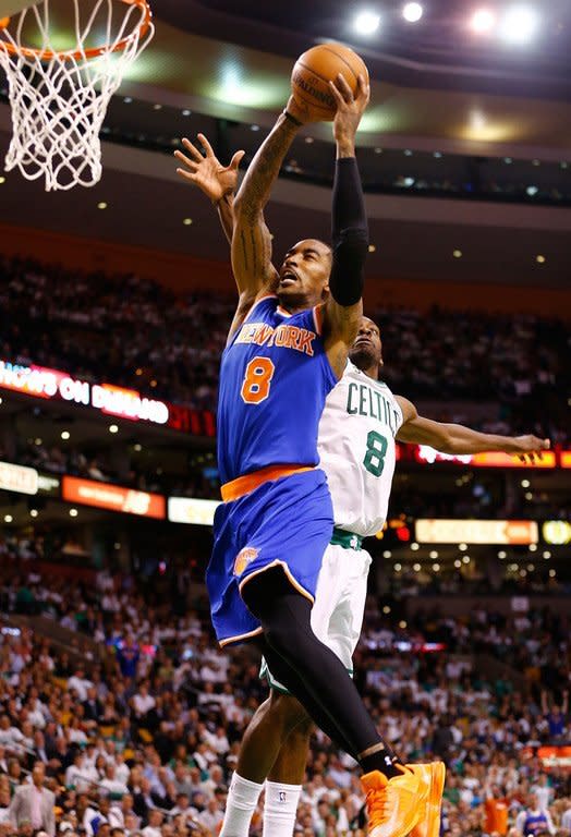 J.R. Smith of the New York Knicks dunks the ball over Jeff Green of the Boston Celtics on April 26, 2013. New York will try to complete the sweep on Boston's court on Sunday