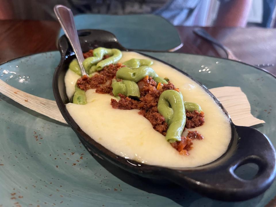 queso in a cast iron serving dish from la hacienda de san angel in disney world