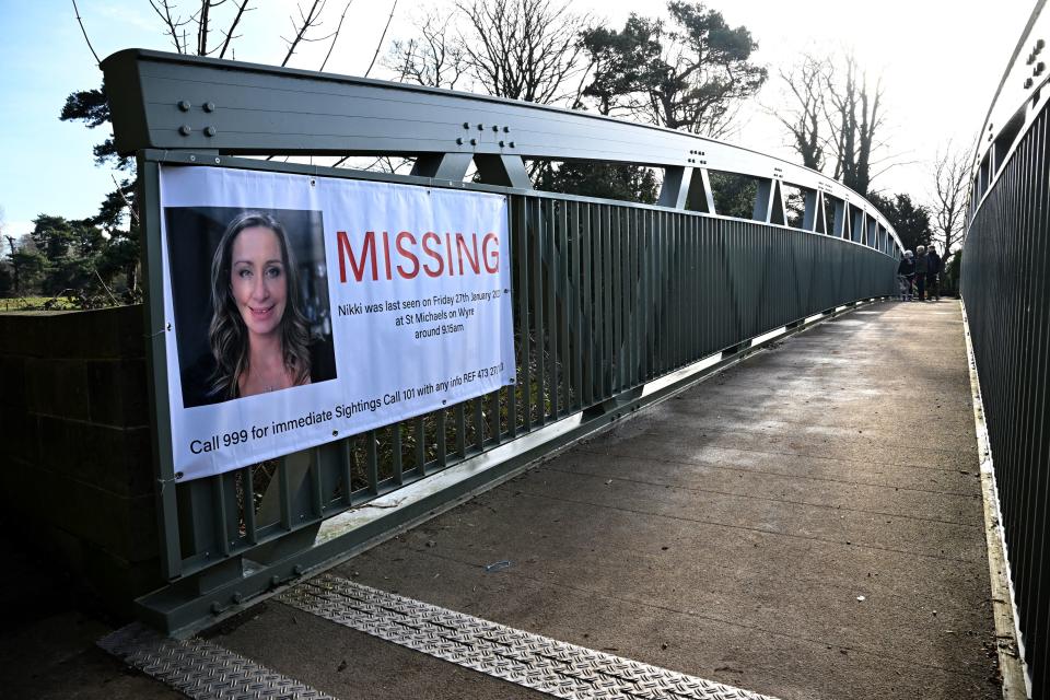 A banner asking for information on missing Nicola 'Nikki' Bulley is pictured on a bridge in St Michael's on Wyre, near Preston, north west England on February 6, 2023, as the search for her  continues. - Specialist divers were on Monday scouring a river bed for traces of a missing woman, more than a week after she appeared to 