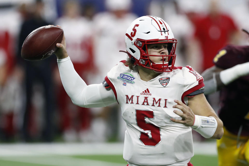 FILE - In this Dec. 7, 2019, file photo, Miami of Ohio quarterback Brett Gabbert throws during the second half of the Mid-American Conference championship NCAA college football game against Central Michigan, in Detroit. The Mid-American Conference on Saturday, Aug. 8, 2020, became the first league competing at college football’s highest level to cancel its fall season because of COVID-19 concerns. With the MAC’s 12 schools facing a significant financial burden by trying to maintain costly coronavirus protocols, the conference’s university presidents made the decision to explore a spring season. (AP Photo/Carlos Osorio, File)