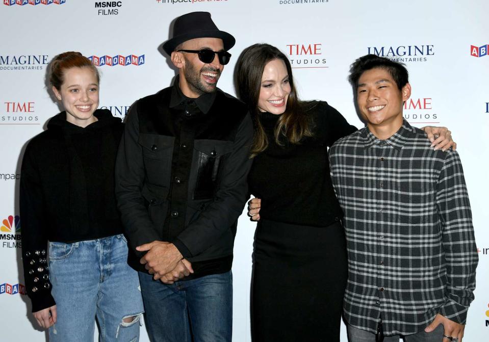 Shiloh Jolie-Pitt, street artist JR, actress Angelina Jolie and Pax Thien Jolie-Pitt attend the Los Angeles premiere of MSNBC Films' "Paper & Glue: A JR Project" at Museum Of Tolerance on November 18, 2021 in Los Angeles, California