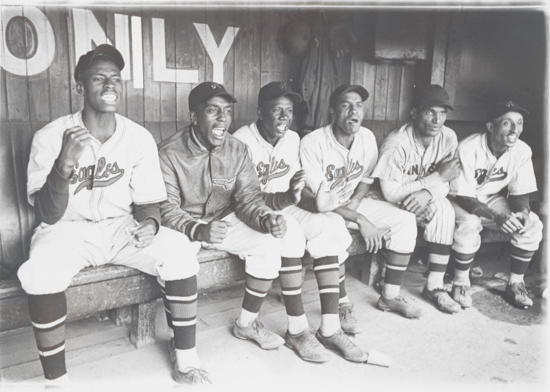 The 1936 Newark Eagles cheer on their teammates, shown in "The League," a history of Negro Leagues baseball.