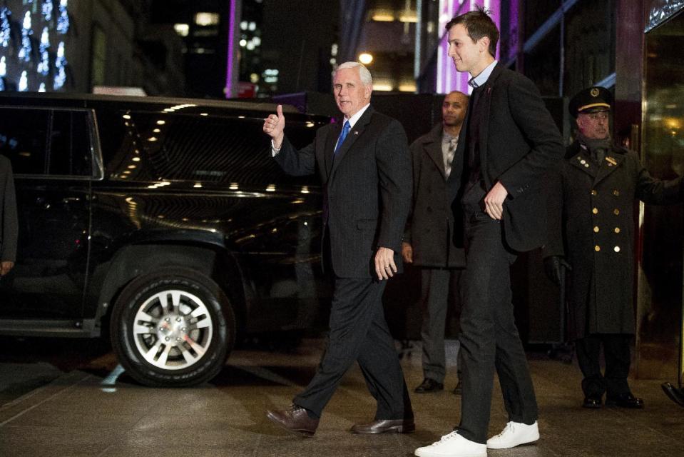 FILE - In this Dec. 7, 2016 file photo, Vice President-elect Mike Pence, left, and Jared Kushner, second from right, depart from Trump Tower, in New York. Kushner, President-elect Donald Trump's son-in-law and one of his closest advisers, is taking steps to distance himself from his sprawling New York real estate business in what is the clearest sign yet he is planning to take a position in his father-in-law's administration. Kushner, who is married to Trump's daughter Ivanka, must clear a series of hurdles before he takes any post in Washington. (AP Photo/Andrew Harnik)