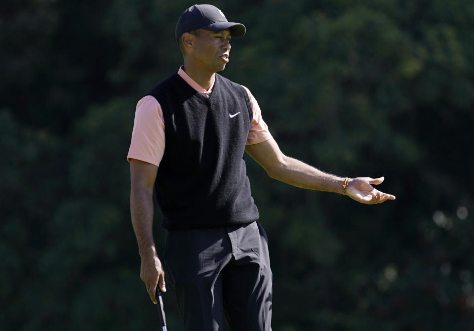 Tiger Woods reacts after missing a putt on the eighth hole during the first round of the Genesis Invitational golf tournament at Riviera Country Club, Thursday, Feb. 13, 2020, in the Pacific Palisades area of Los Angeles. (AP Photo/Ryan Kang)