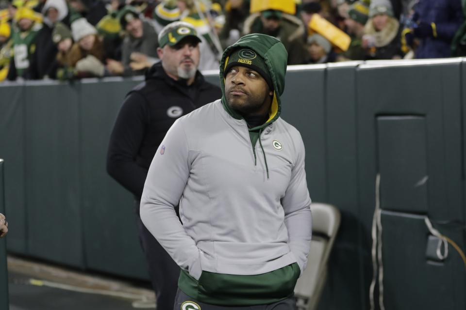 Green Bay Packers' Randall Cobb comes out of the locker room in street clothes during the second half of an NFL football game against the Los Angeles Rams Sunday, Nov. 28, 2021, in Green Bay, Wis. (AP Photo/Aaron Gash)