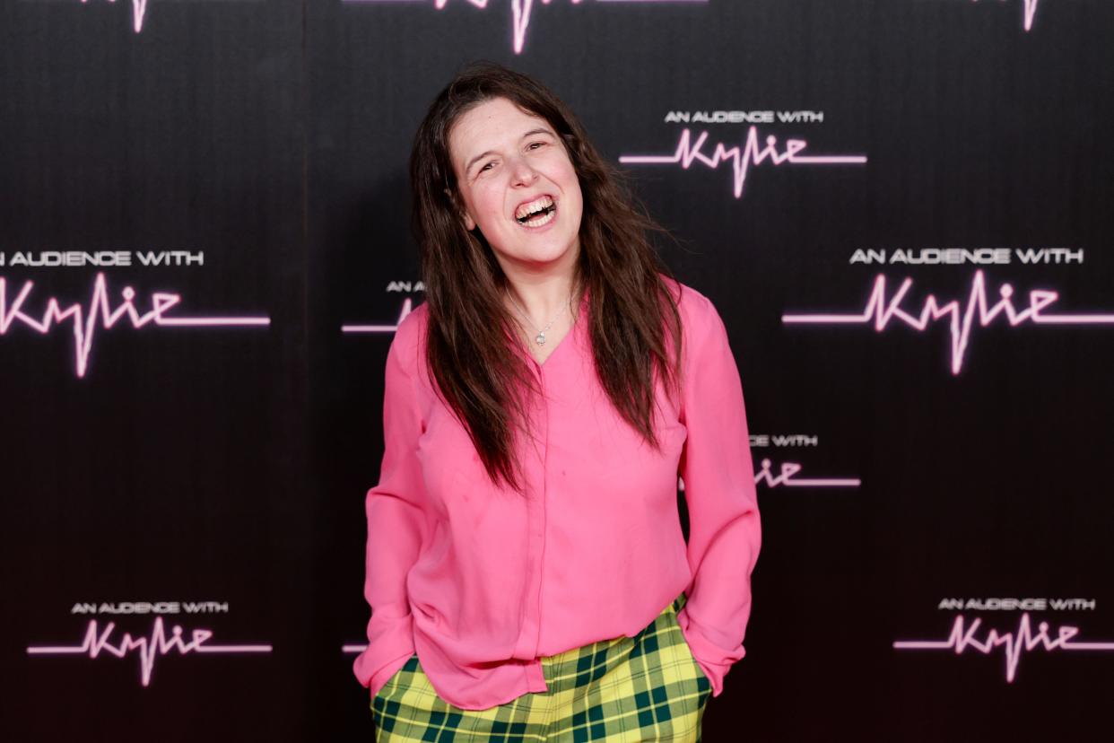 Rosie Jones poses for photographers upon arrival for 'An Audience with Kylie' at the Royal Albert Hall, in London, Friday, Dec. 1, 2023. (Photo by Millie Turner/Invision/AP)