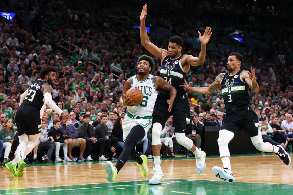 Celtics guard Marcus Smart drives to the basket in the second quarter against the Milwaukee Bucks.