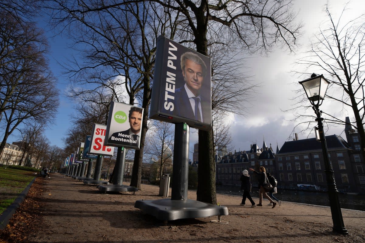 An election billboard for anti-islam lawmaker Geert Wilders is seen near the parliament building in The Hague, Netherlands, Monday, 20 November 2023 (Associated Press)