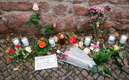 Flowers and candles are seen outside the synagogue in Halle