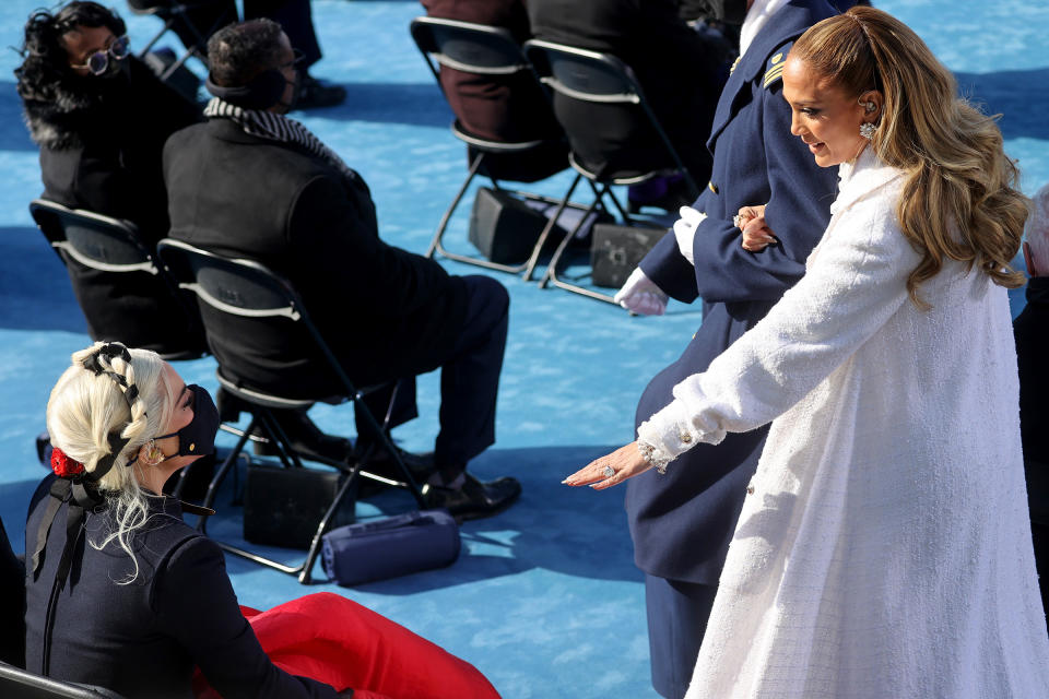 Jennifer Lopez, right, greets Lady Gaga during the 59th presidential inauguration.<span class="copyright">Jonathan Ernst—Pool/Reuters</span>