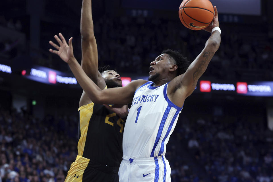Kentucky's Justin Edwards (1) shoots against Texas A&M-Commerce's Jerome Brewer Jr. during the first half of an NCAA college basketball game in Lexington, Ky., Friday, Nov. 10, 2023. (AP Photo/James Crisp)
