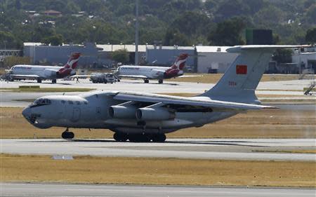 A Chinese Ilyushin IL -76s aircraft lands at Perth International Airport after flying over the southern Indian Ocean as part of the continuing search for the missing Malaysian Airlines flight MH370 April 17, 2014. REUTERS/Rob Griffiths/Pool