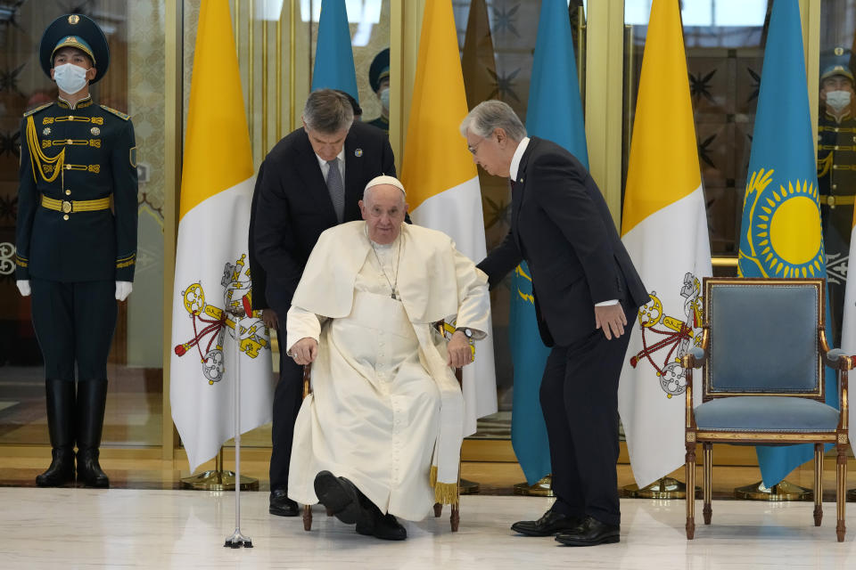 FILE - Pope Francis, left, meets the Kazakhstan's President Kassym-Jomart Tokayev as he arrives at Our-Sultan's International airport in Nur-Sultan, Kazakhstan, on Sept. 13, 2022. Chinese President Xi Jinping's first trip overseas since the early days of the COVID-19 pandemic will overlap with a visit by Pope Francis to Kazakhstan, although the Vatican says there are no plans for them to meet. (AP Photo/Andrew Medichini)