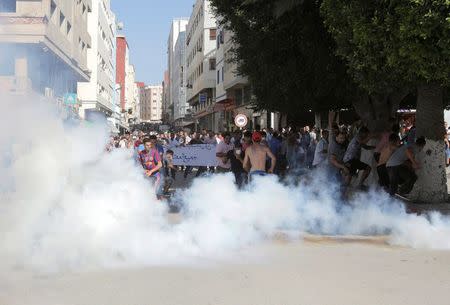 Police fire tear gas towards protesters during a demonstration against official abuses and corruption in the town of Al-Hoceima, Morocco July 20, 2017. REUTERS/Youssef Boudlal