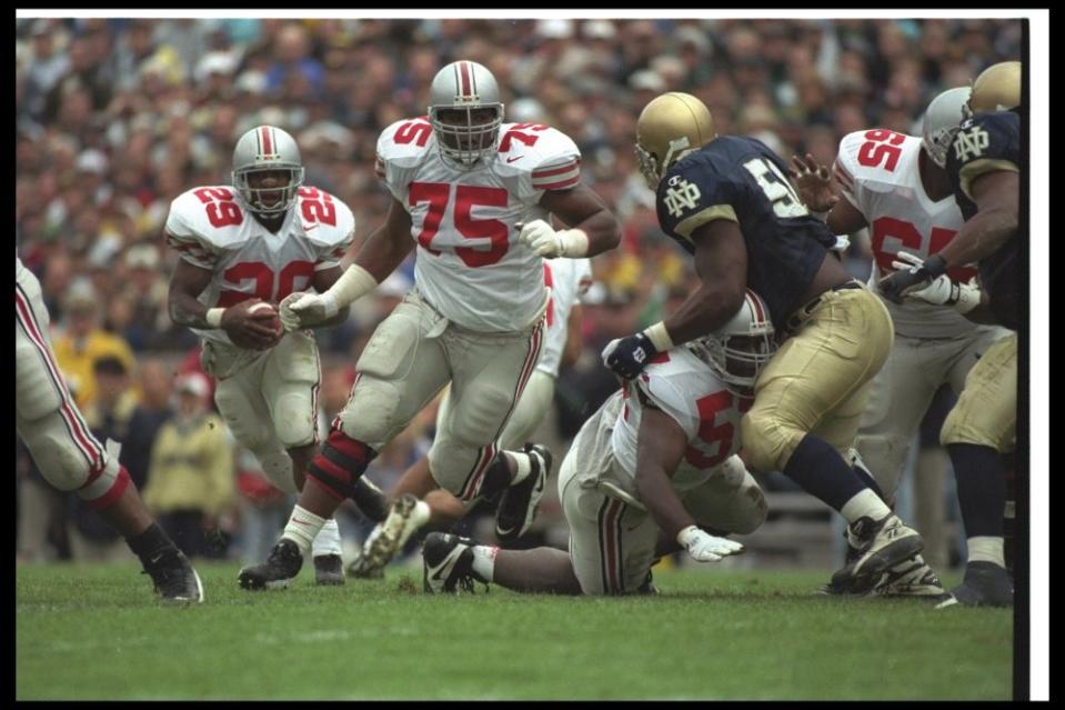 28 Sep 1996: Offensive lineman Orlando Pace of the Ohio State Buckeyes (center) looks to block a Notre Dame Fighting Irish player during a game at Notre Dame Stadium in South Bend, Indiana. Ohio State won the game, 29-16. Mandatory Credit: Jonathan Daniels