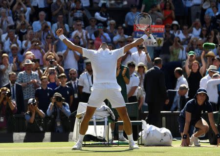 Tennis - Wimbledon - All England Lawn Tennis and Croquet Club, London, Britain - July 15, 2018 Serbia's Novak Djokovic celebrates winning the men's singles final against South Africa's Kevin Anderson REUTERS/Tony O'Brien