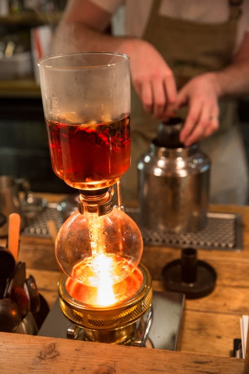 Cafe owner Mike Haggerton prepares a pot of Dalreoch white tea using a syphon brewer, at the Habitat Cafe in Aberfeldy, Scotland