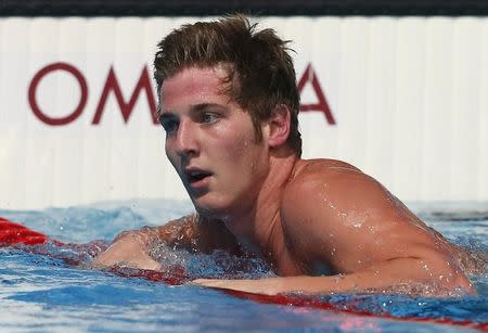 James Feigen of the U.S. reacts after winning the men's 100m freestyle semi-final during the World Swimming Championships at the Sant Jordi arena in Barcelona July 31, 2013. REUTERS/Albert Gea/Files