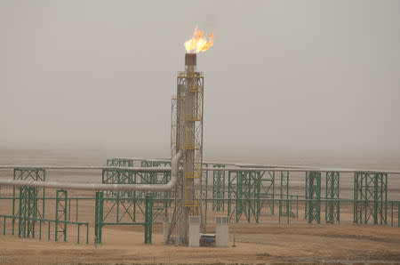 FILE PHOTO: Excess gas is burnt off at a pipeline at the Zubair oilfield in Basra, Iraq May 9, 2018. REUTERS/Essam al-Sudani/File photo