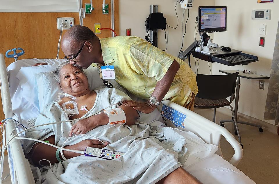 Carolyn McLeod gets a kiss from her husband, William, while waiting for her heart transplant in the hospital in Chicago.