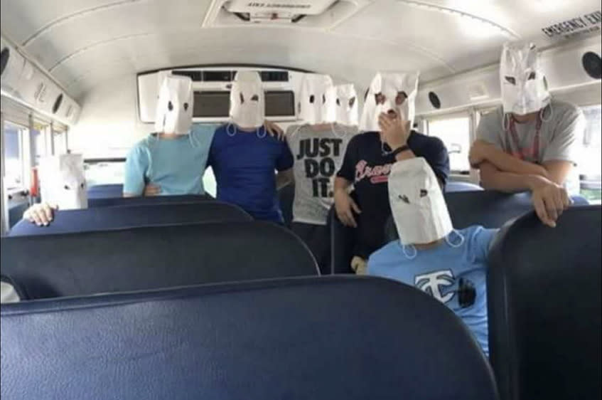 A group of high school tennis players from Georgia were seen in a photo wearing white bags over their heads with eyes cut out — similar to white hoods. (Twitter/Anastasia Graham)