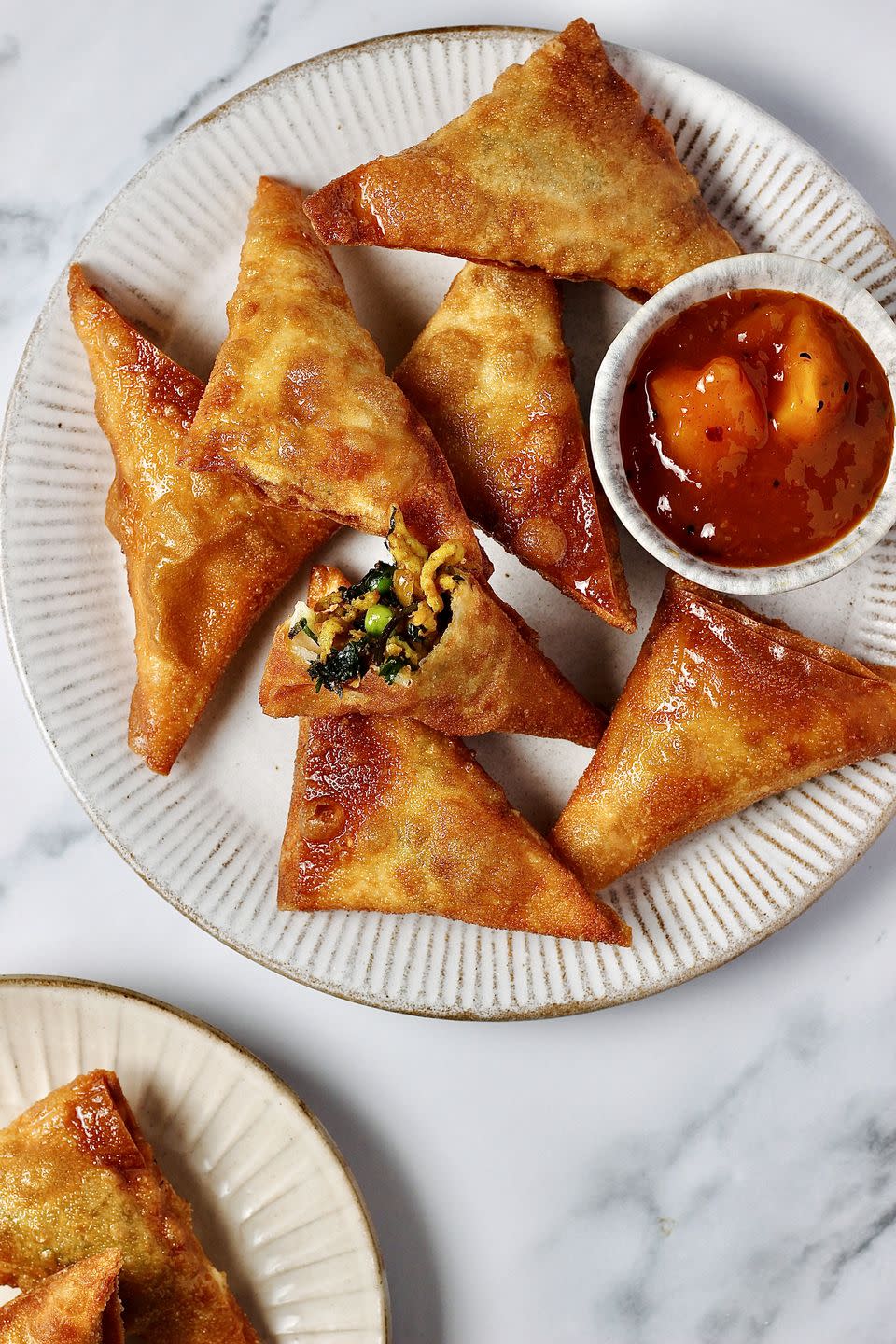 <p>If you're planning an Indian-inspired dinner party, there's no better place to start than a delicious homemade samosa.</p><p>Get the <a href="https://www.delish.com/uk/cooking/recipes/a43059680/samosa/" rel="nofollow noopener" target="_blank" data-ylk="slk:Chicken Samosa;elm:context_link;itc:0;sec:content-canvas" class="link ">Chicken Samosa</a> recipe.</p>