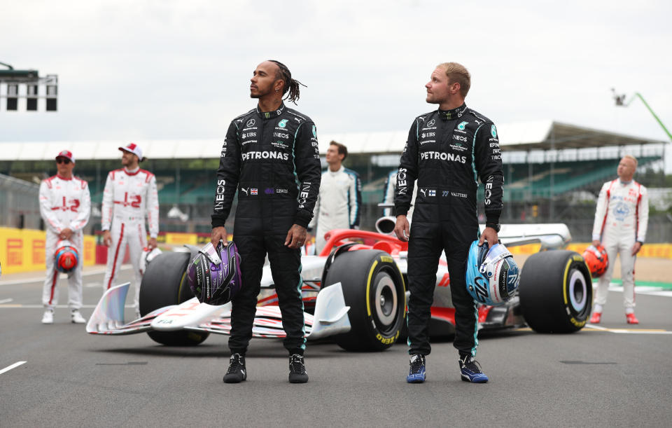 <p>Mercedes� Valtteri Bottas (right) and Lewis Hamilton (left) during the launch of the new 2022 Formula 1 car ahead of the British Grand Prix at Silverstone, Towcester. Picture Date: Thursday July 15, 2021.</p>
